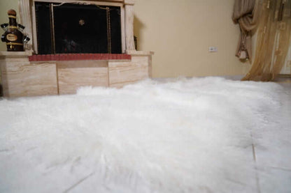 White Wool Sheepskin Mongolian Blanket Throw - Tatifurs displayed in a cozy interior setting.