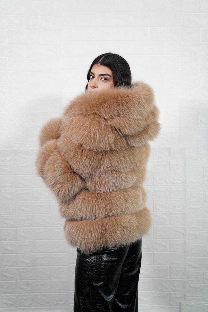 Back view of camel brown fox fur coat with hood
