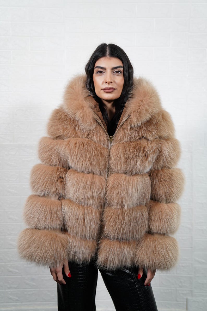 Camel brown full skin fox fur coat with leather lines, hood, and zipper, front view
