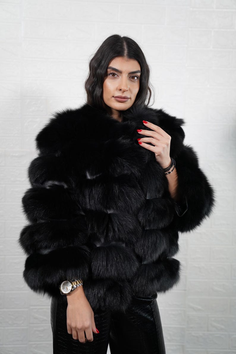 Black fox fur short jacket with leather lines, front view

