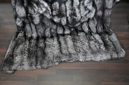 Fox Fur Blanket Throw Silver Natural - Tatifurs on a wooden floor, showcasing luxurious natural silver fox fur texture.