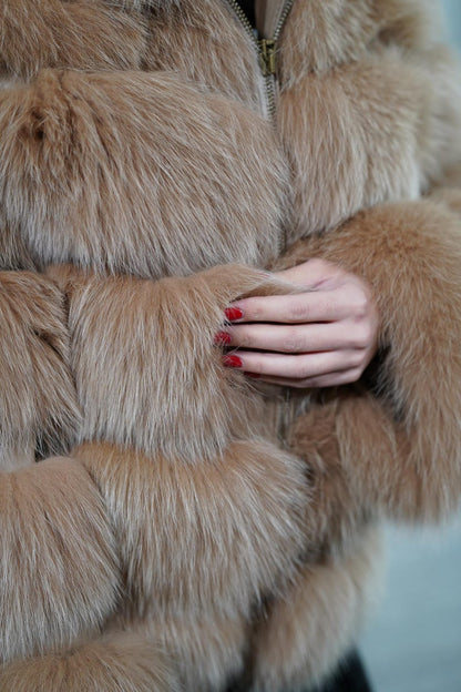 Close-up of leather lines between camel brown fox fur panels
