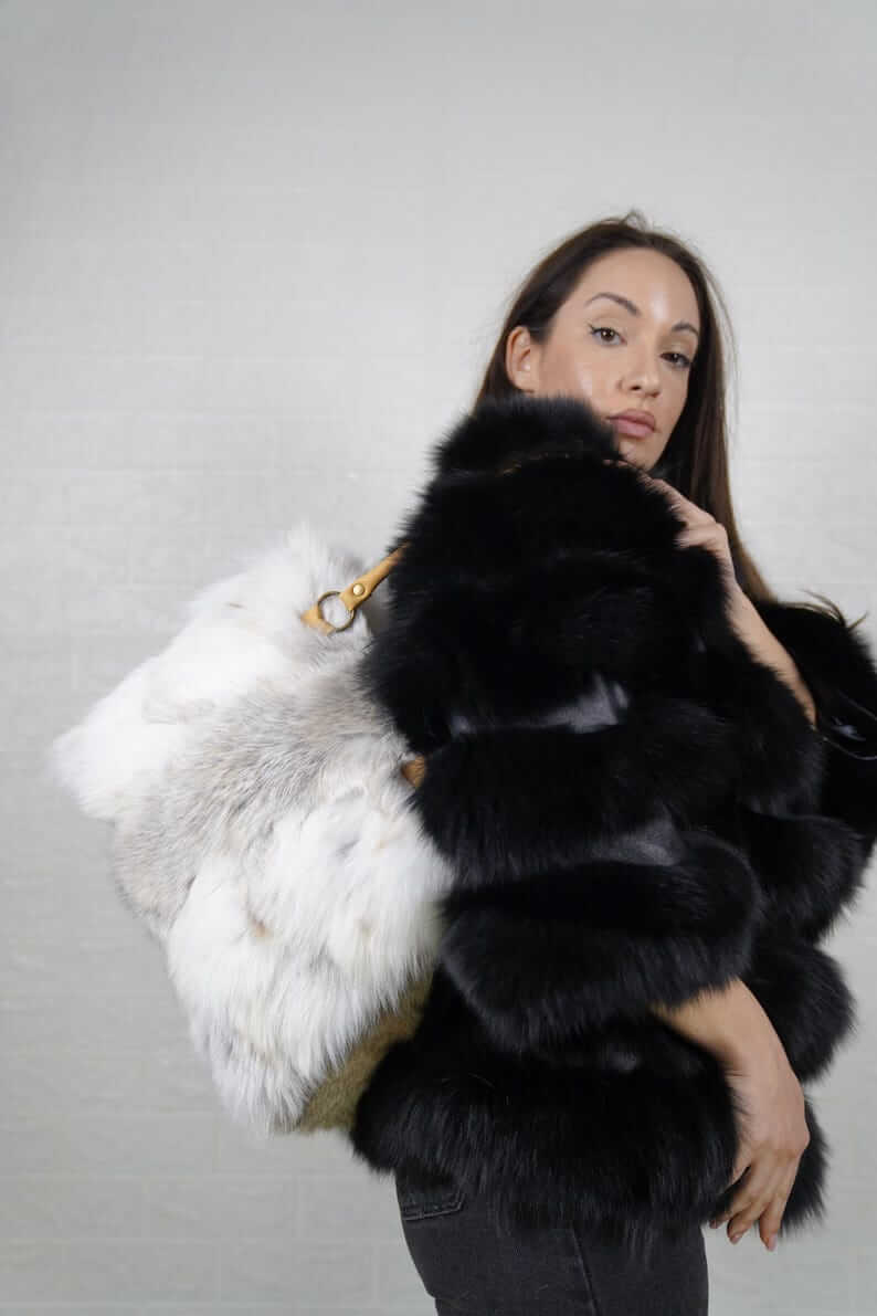 Natural golden fox fur bag styled as a warm radiant evening accessory
