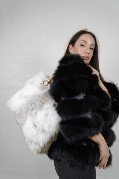 Natural golden fox fur bag styled as a warm radiant evening accessory
