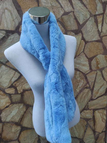 Rex Rabbit Fur Scarf Light Blue - Tatifurs displayed on a mannequin against a stone wall.
