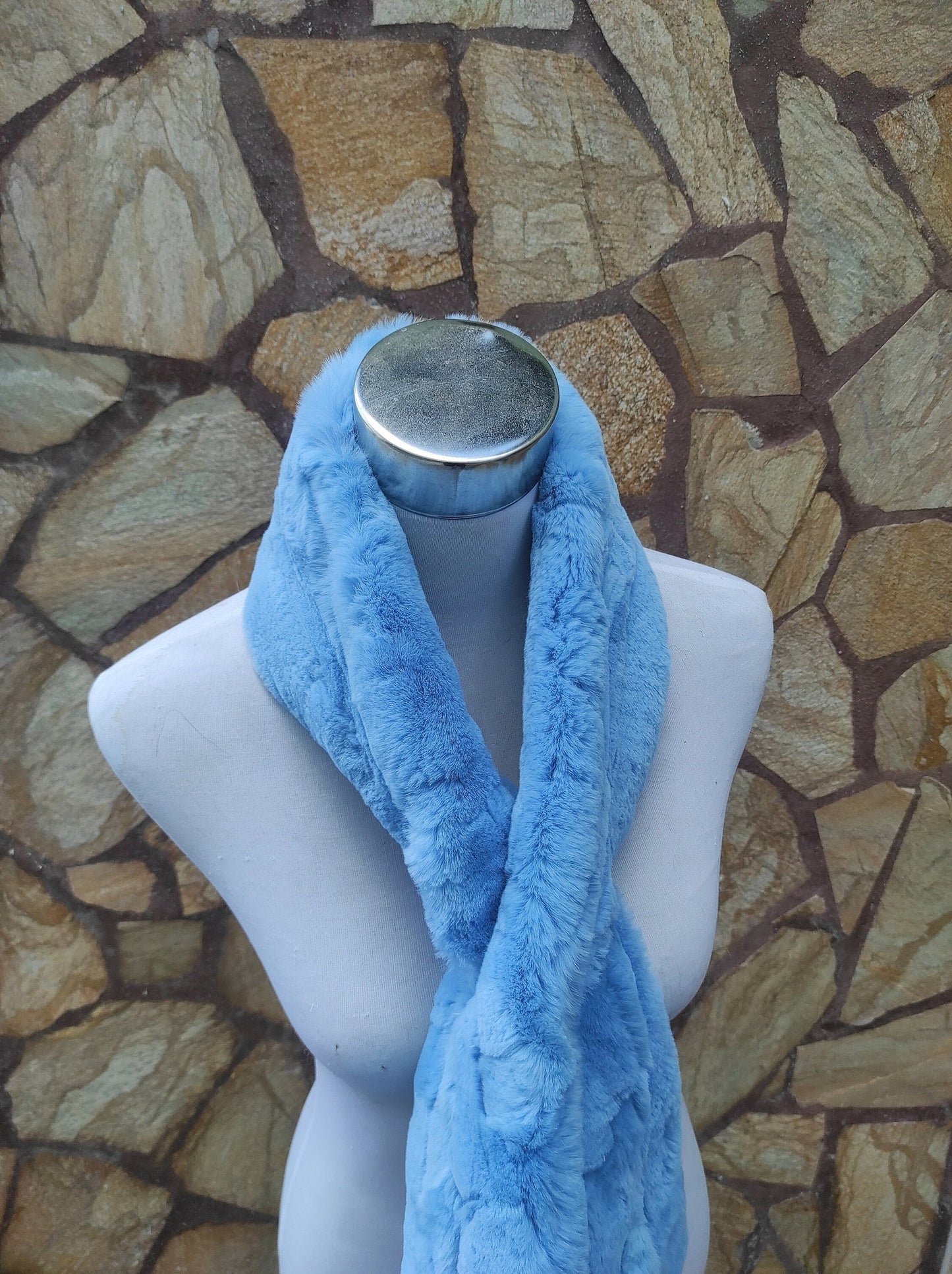 Rex Rabbit Fur Scarf Light Blue - Tatifurs displayed on a mannequin against a stone wall background.