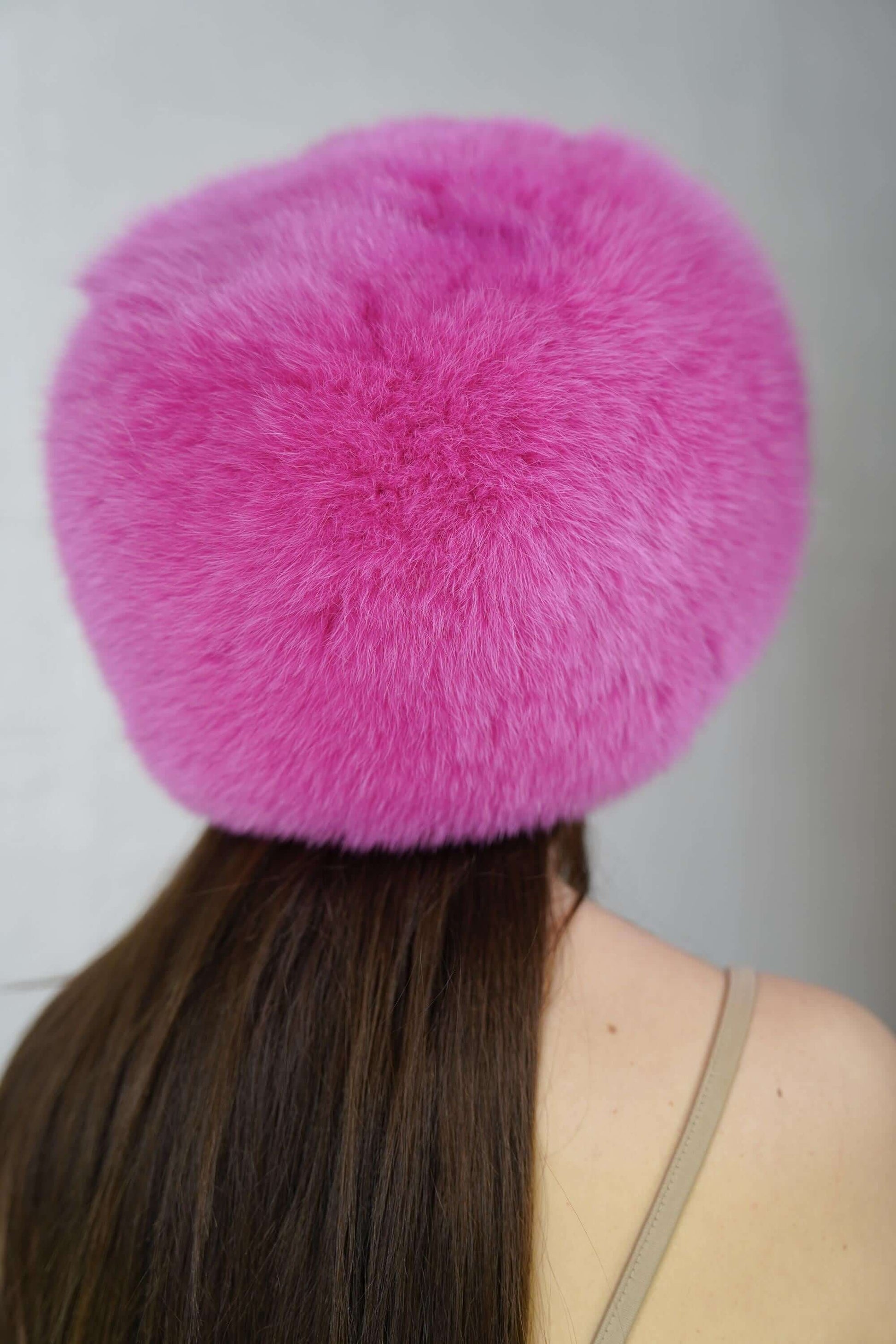 Fox Fur Hat Pink Full Skin - Tatifurs worn from the back, showcasing vibrant fuchsia pink fur.