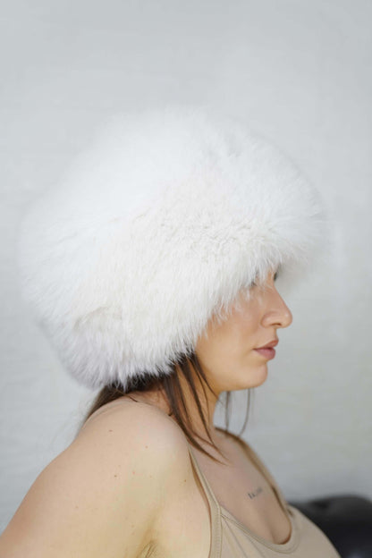 Fox Fur Hat White Full Skin - Tatifurs worn by a model, showcasing its dense white fur and elegant design.