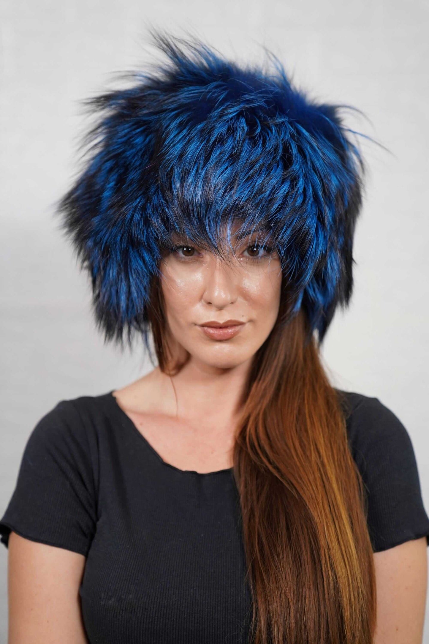 Fox Fur Hat Blue Black - Tatifurs model showcasing the stylish blue and black fox fur hat on a light background.