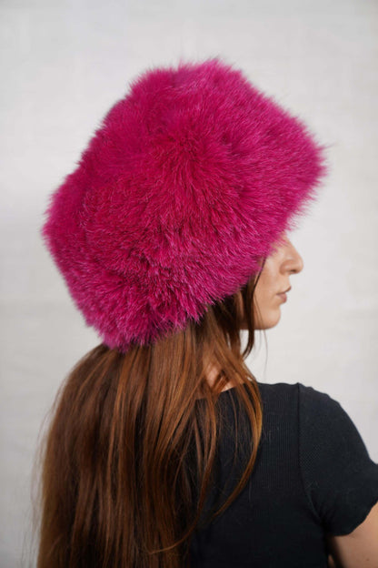 Fox Fur Hat Fuchsia Full Skin - Tatifurs worn by a model showcasing its vibrant color and luxurious texture.