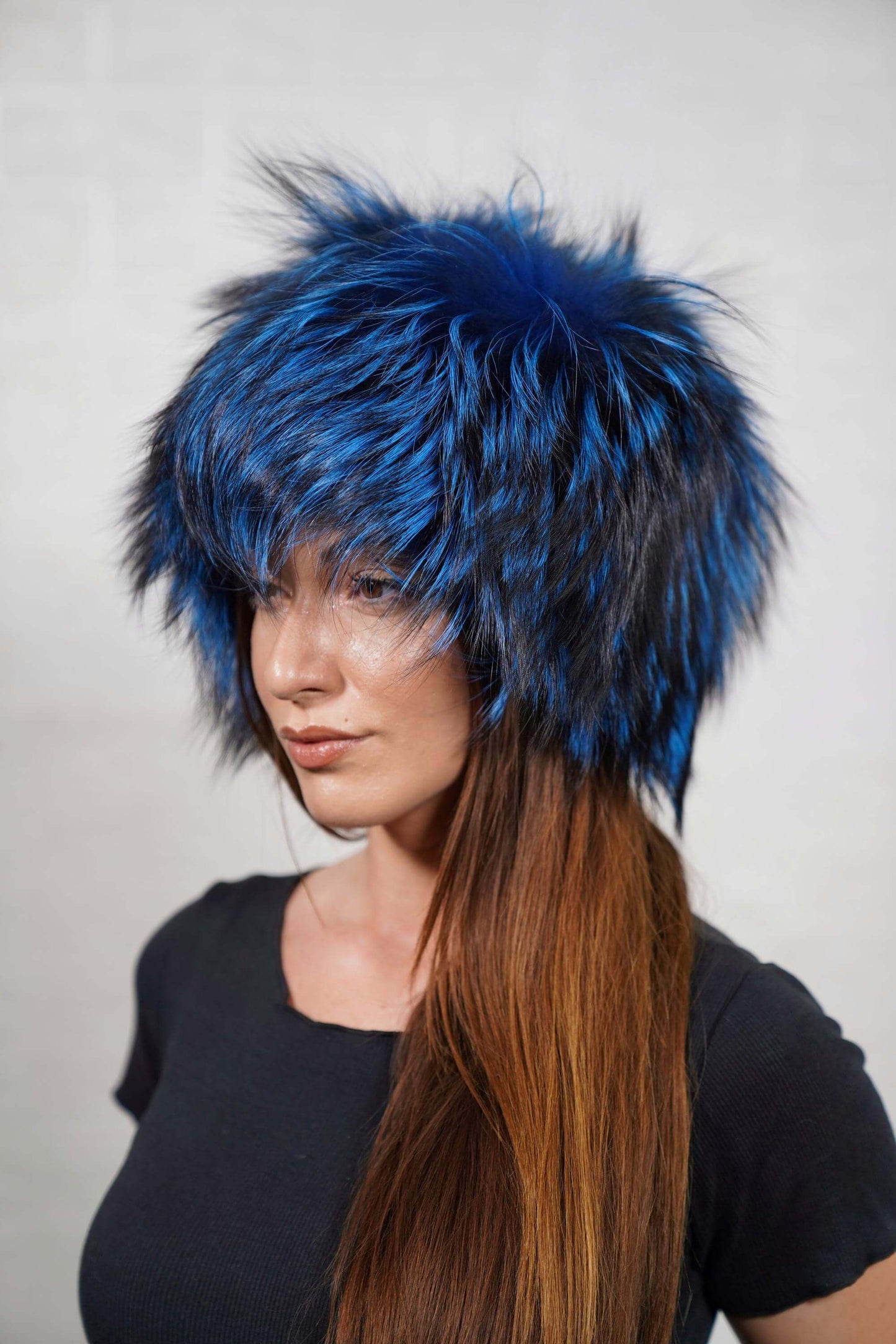 Fox Fur Hat Blue Black - Tatifurs worn by a model, showcasing luxurious blue and black fox fur.