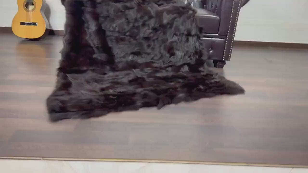 Fox Fur Blanket Throw Brown - Tatifurs draped over a chair, showcasing its luxurious texture and color.