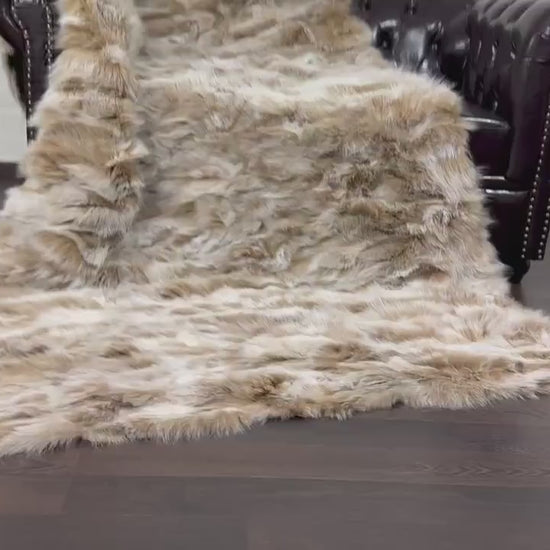 fox fur throw blanket beige — draped across cream sofa, warm beige and white against neutral base — Greek craftsmanship, TatiFurs
