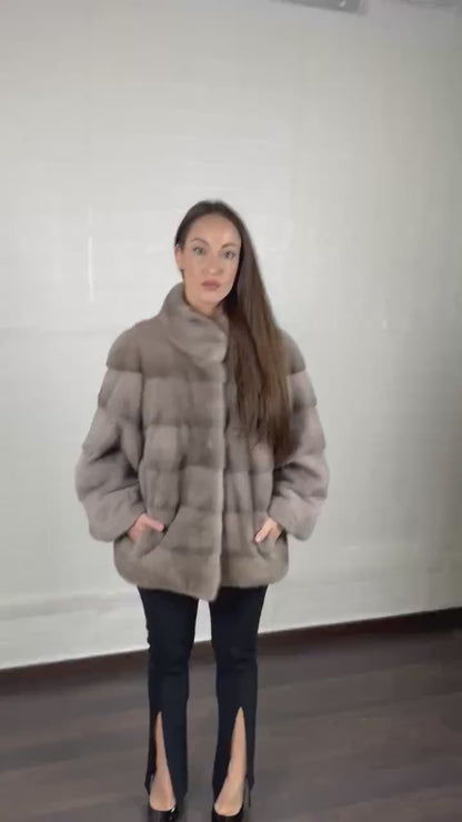 Model wearing elegant gray mink fur jacket coat with collar full skin pelts, handmade in Greece, showing fit and luxurious movement
