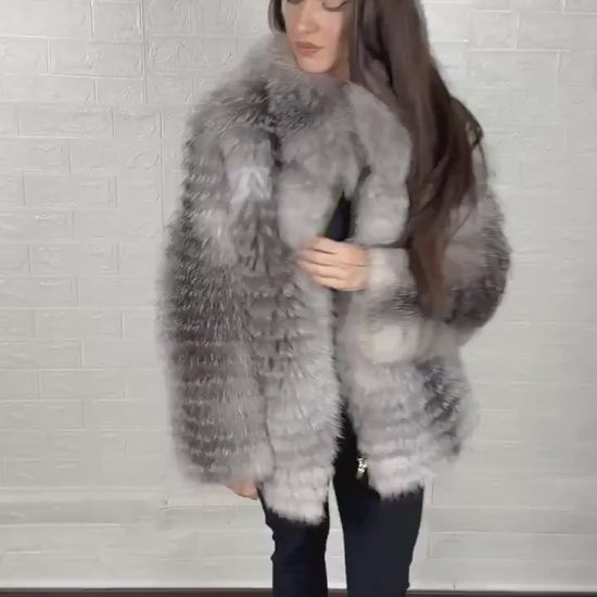 Detail shot of zipper closure on frost fox fur coat
