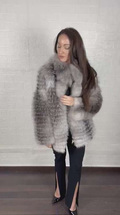 Detail shot of zipper closure on frost fox fur coat
