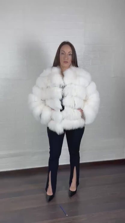 White fox fur jacket styled for a winter evening look
