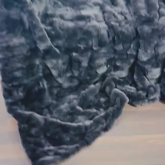 Rabbit Blanket Throw Rex Gray - Tatifurs displayed on a wooden floor showcasing its plush texture.