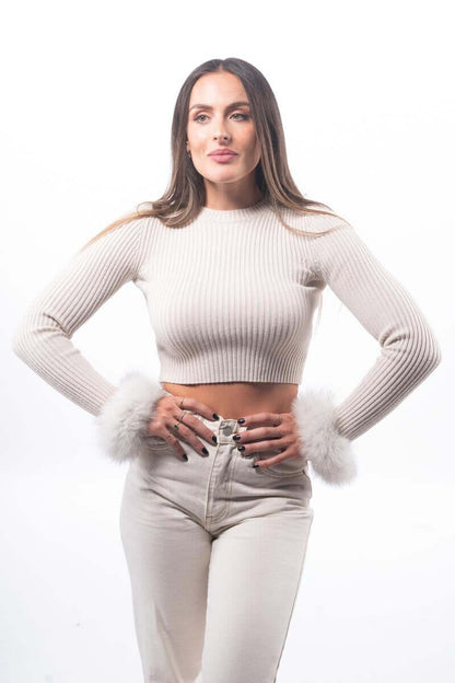 Natural Blue Fox Fur Cuffs - Tatifurs worn with a cream ribbed crop top, showcasing the luxurious fur detail.
