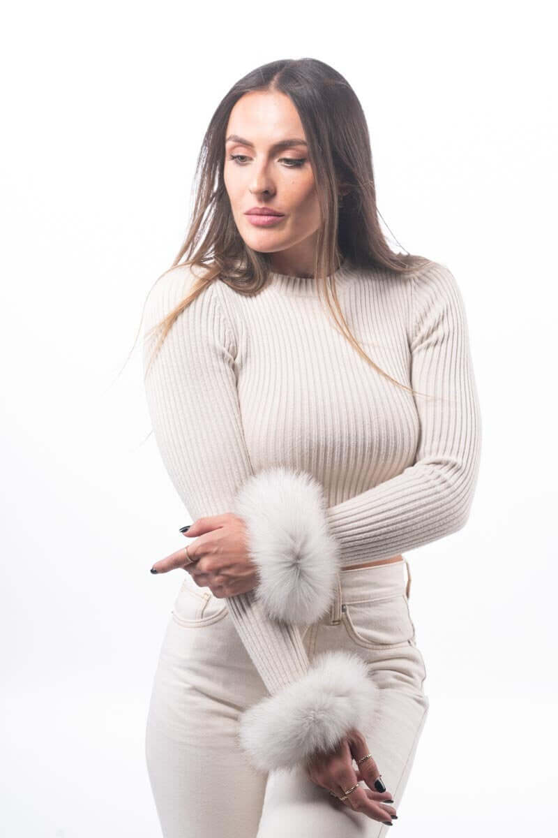 Model wearing Natural Blue Fox Fur Cuffs - Tatifurs with a stylish top and light-colored pants.