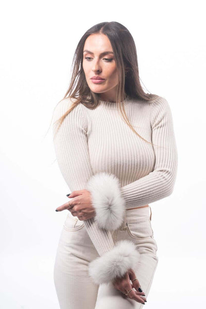 Model wearing Natural Blue Fox Fur Cuffs - Tatifurs with a stylish top and light-colored pants.