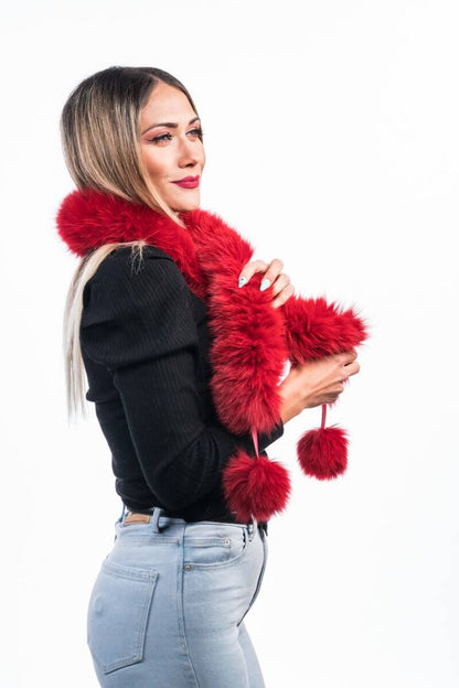 Red Fox Fur Scarf with Pom Poms - Tatifurs worn by a model, showcasing its vibrant color and playful design.