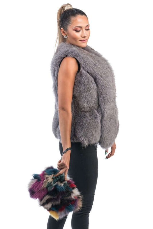 Model showcasing a stylish Fox Fur Handbag Multicolor - Tatifurs while wearing a fur vest.