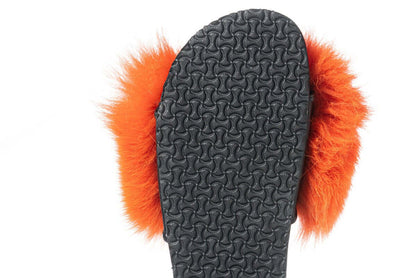 Fox Fur Slides Orange - Tatifurs, showcasing the black sole and vibrant orange fur puffs for a luxurious look.