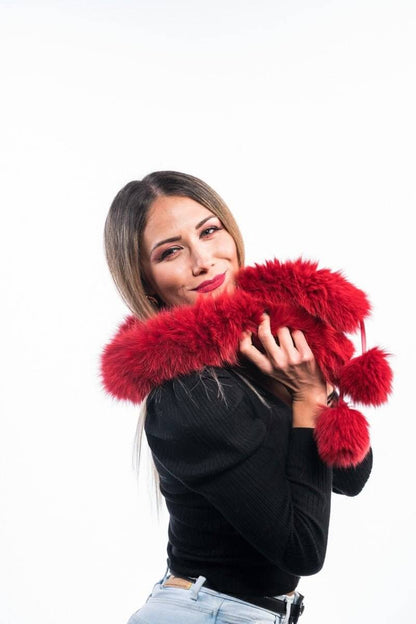 Red Fox Fur Scarf with Pom Poms - Tatifurs being modeled by a smiling woman, showcasing its vibrant color and playful design.