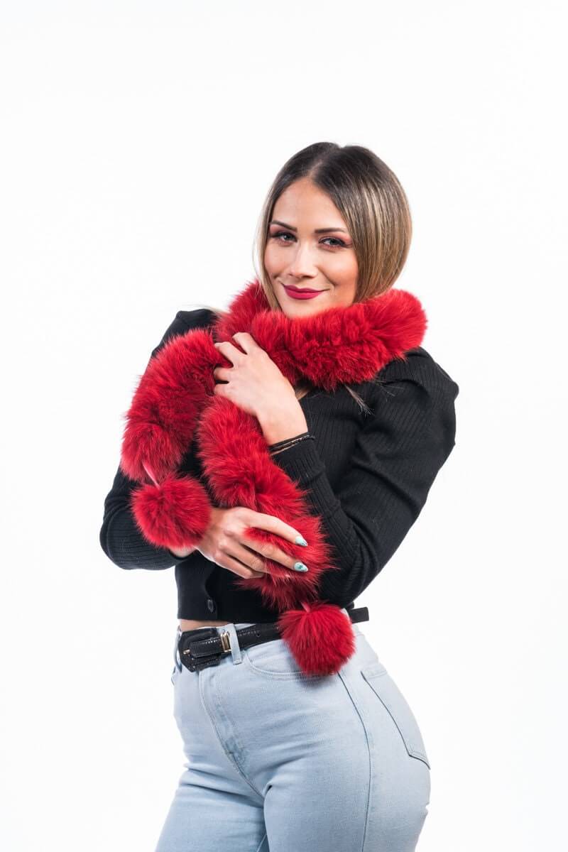Red Fox Fur Scarf with Pom Poms - Tatifurs, a woman wearing a stylish red fox fur scarf with playful pom poms.