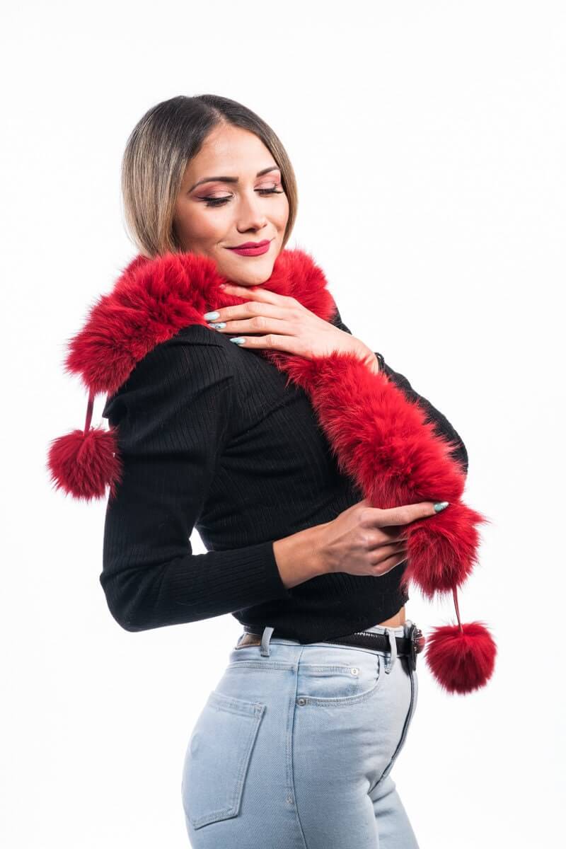 Red Fox Fur Scarf with Pom Poms - Tatifurs being modeled, showcasing its vibrant color and playful design.