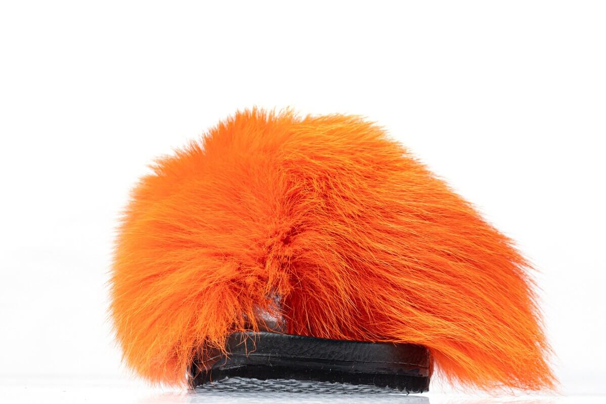 Fox Fur Slides Orange - Tatifurs showcasing vibrant orange fur with black base, ideal for a stylish everyday wear.