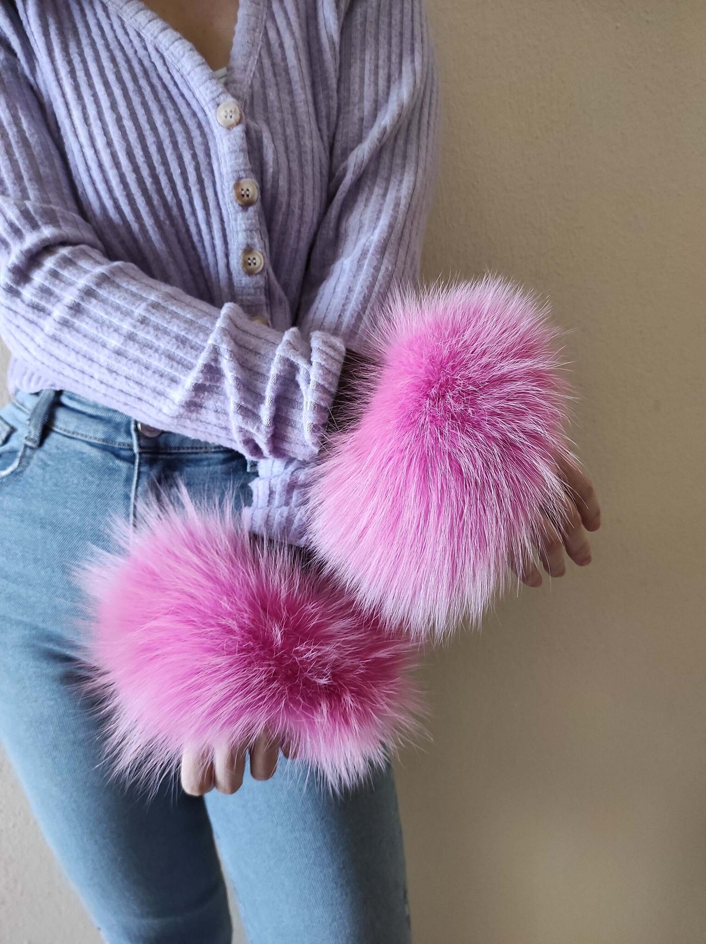 Fuchsia Fox Fur Cuffs - Tatifurs worn by a model, showcasing vibrant fuchsia fur that captivates attention.