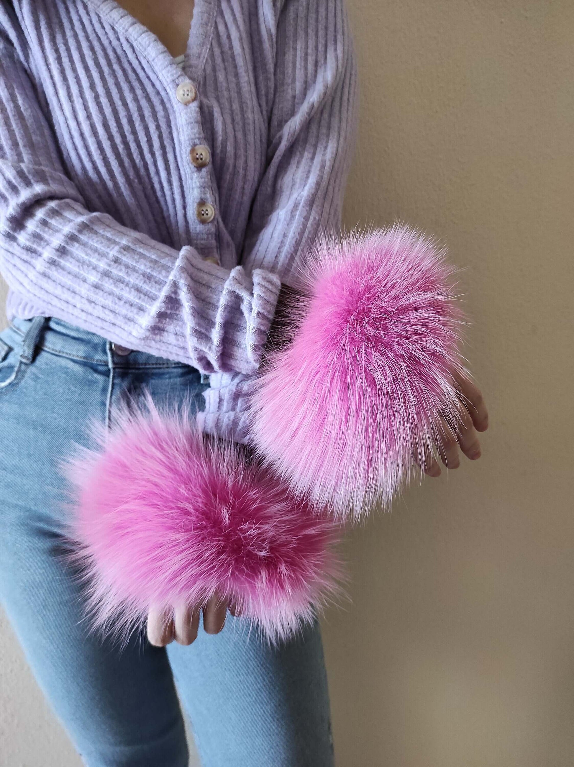 Fuchsia Fox Fur Cuffs - Tatifurs worn by a model, showcasing vibrant fuchsia fur that captivates attention.