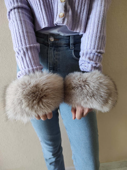 Gray Fox Fur Cuffs - Tatifurs showcased on a model's wrists, emphasizing natural gray fox fur elegance.