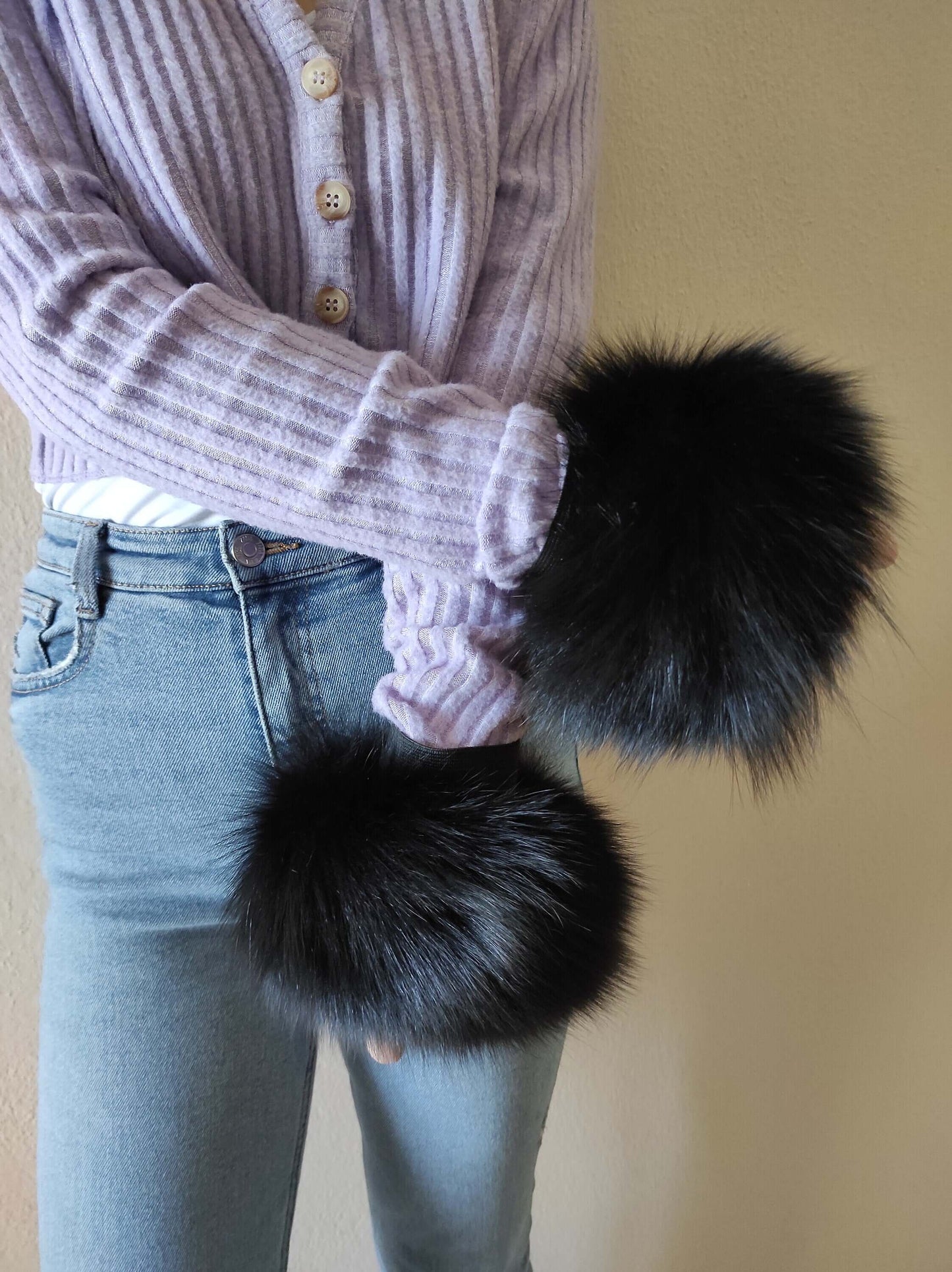 Black Fox Fur Cuffs - Tatifurs worn with a purple sweater, showcasing the luxurious black fur style.