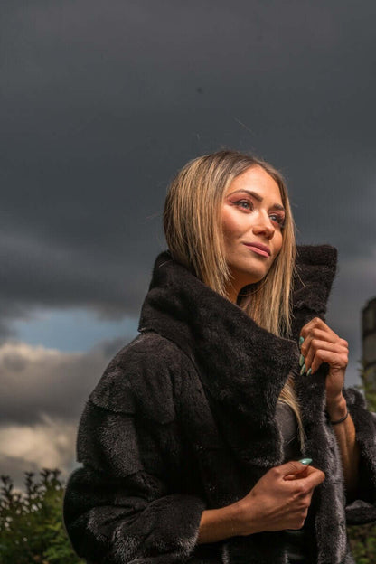 Mink Fur Jacket Black with collar - Tatifurs worn by a model outdoors against a dramatic sky.