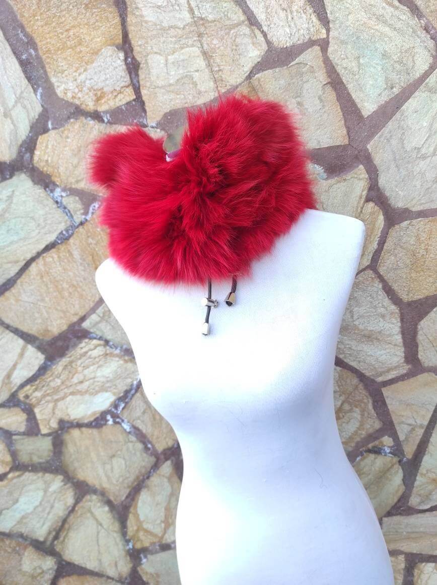 Red Fox Fur Neck Warmer Scarf - Tatifurs displayed on a mannequin against a natural stone background.