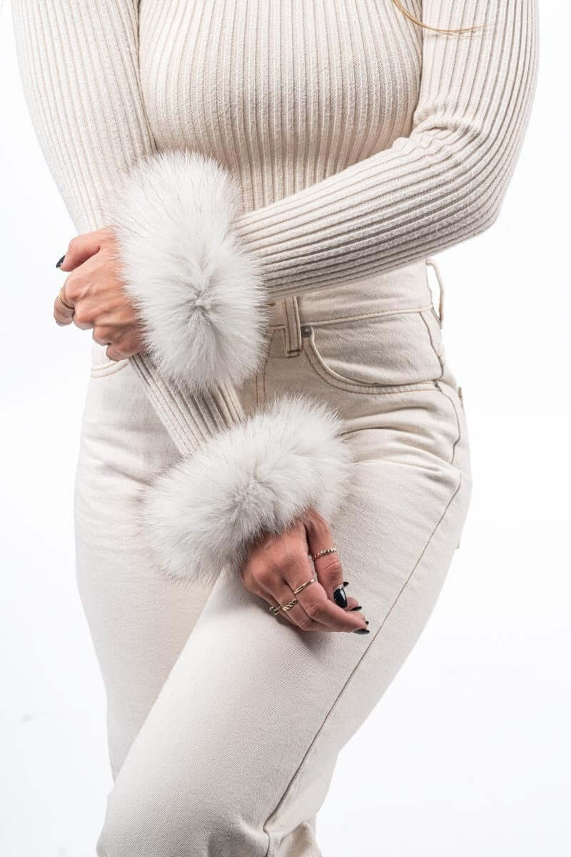 Natural Blue Fox Fur Cuffs - Tatifurs elegantly worn on wrists with a stylish outfit.