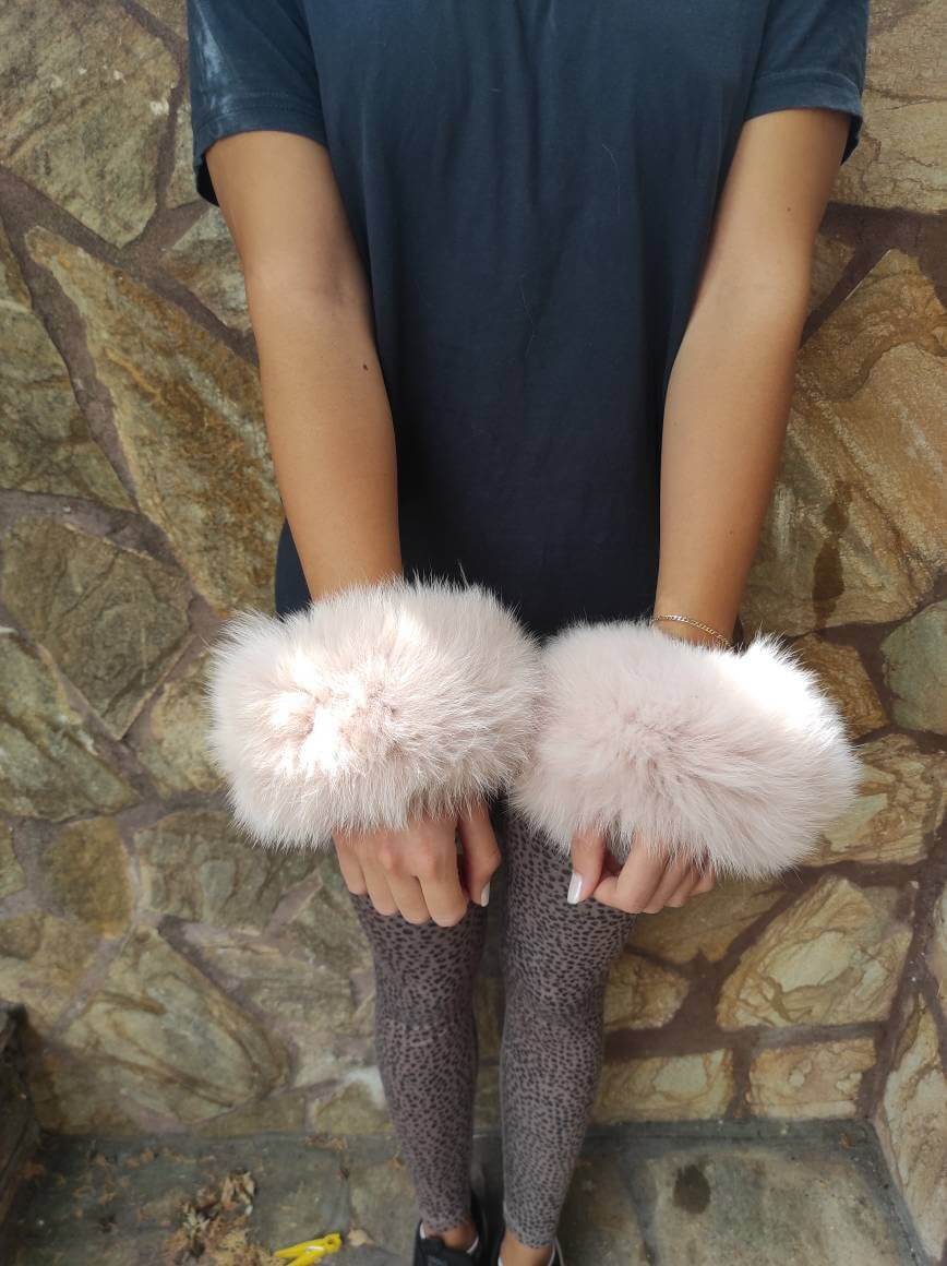 Baby Pink Fox Fur Cuffs - Tatifurs worn on wrists, showcasing soft and delicate blush color.