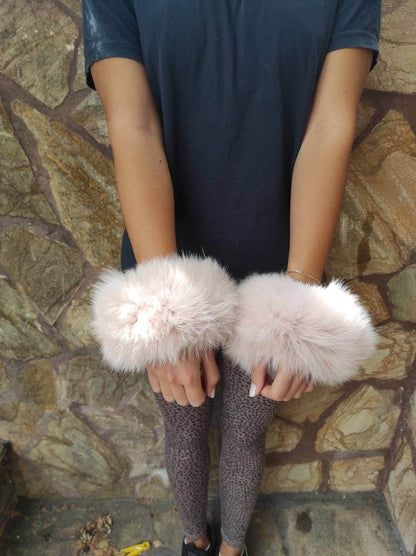 Baby Pink Fox Fur Cuffs - Tatifurs worn on wrists, showcasing soft and delicate blush color.