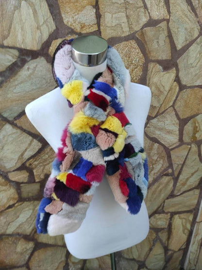 Rex Rabbit Fur Scarf Colorful - Tatifurs displayed on a mannequin showcasing its vibrant, bold colors and soft texture.