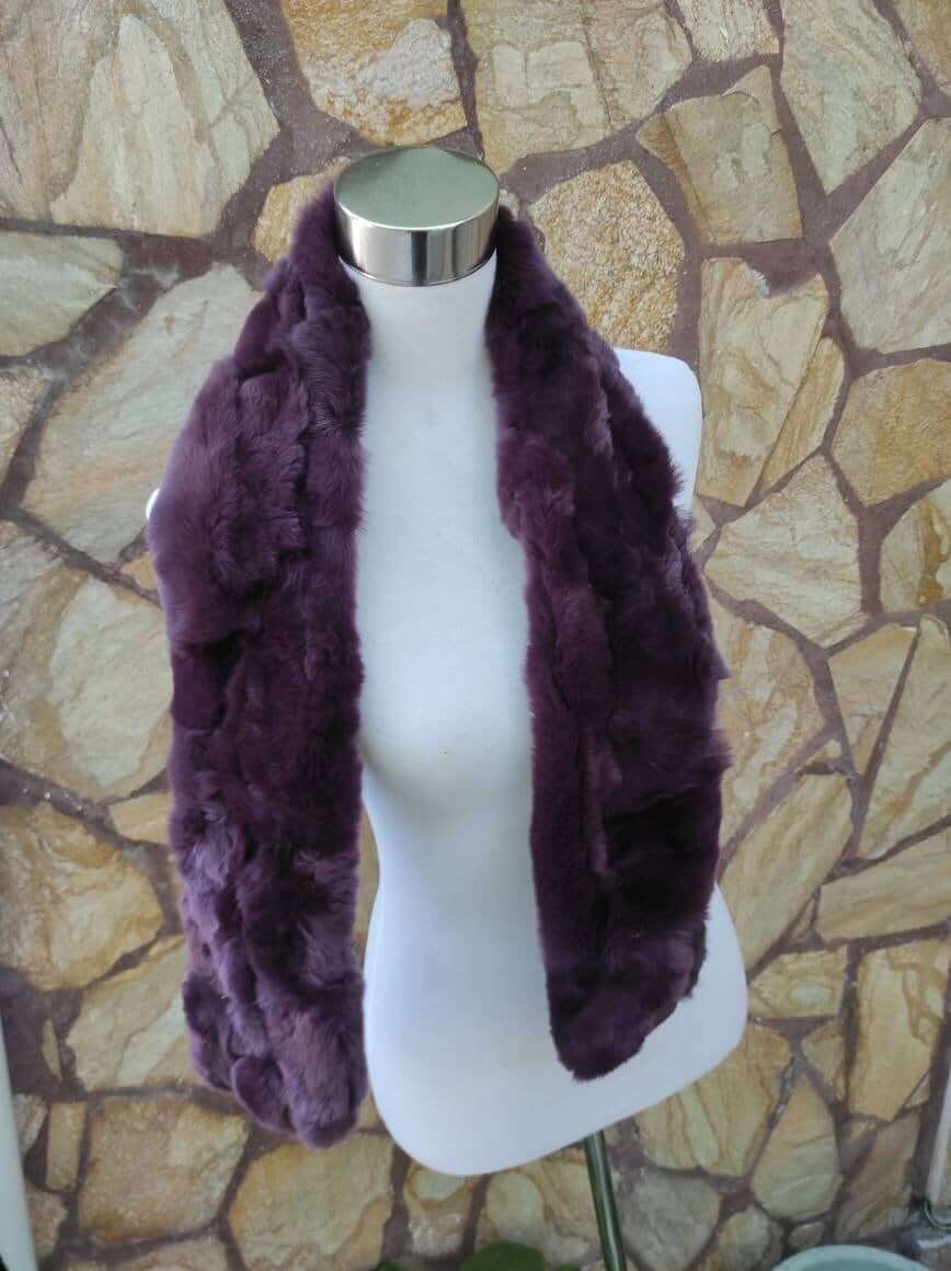 Rex Rabbit Fur Scarf Purple - Tatifurs displayed on a mannequin against a stone background, showcasing luxurious purple fur.