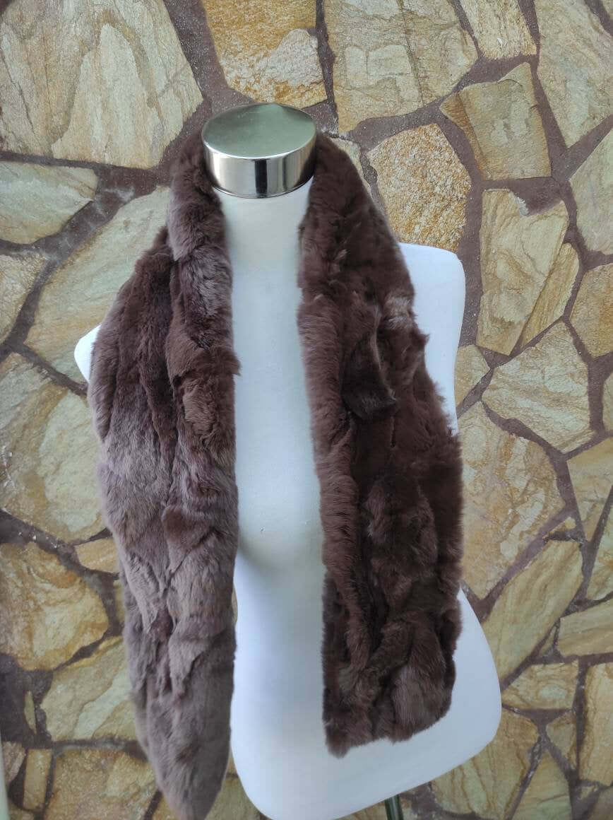 Rex Rabbit Fur Scarf Chocolate Brown - Tatifurs displayed on a mannequin against a textured stone background.