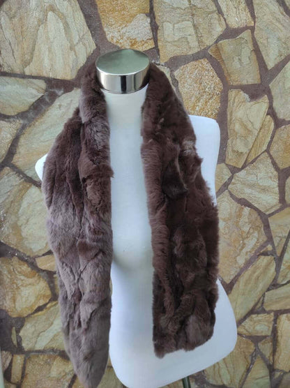 Rex Rabbit Fur Scarf Chocolate Brown - Tatifurs displayed on a mannequin against a textured stone background.