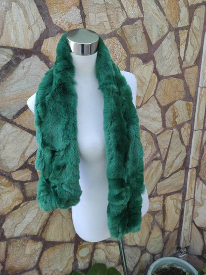 Rex Rabbit Fur Scarf Green - Tatifurs displayed on a mannequin against a stone wall background.