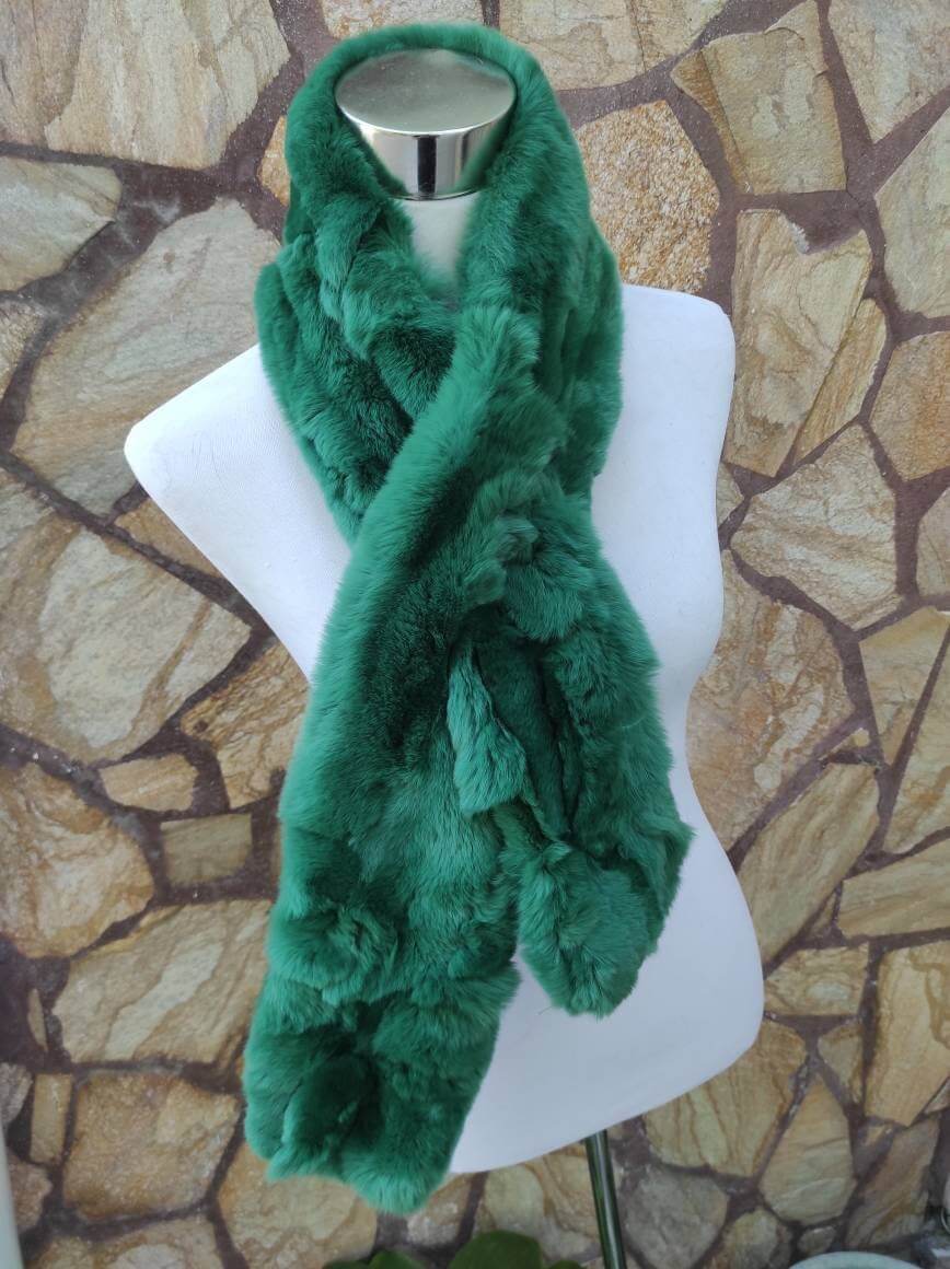 Rex Rabbit Fur Scarf Green - Tatifurs displayed on a mannequin against a stone background.