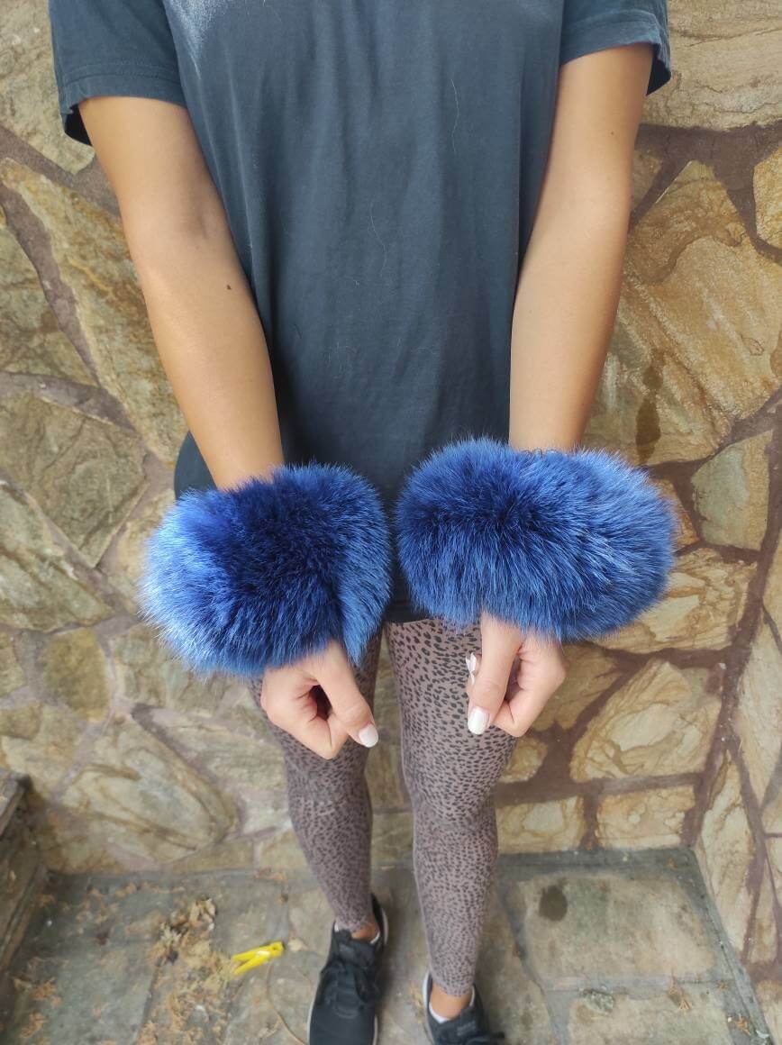 Blue Fox Fur Cuffs - Tatifurs worn on wrists, featuring bold blue fox fur, perfect for striking style.