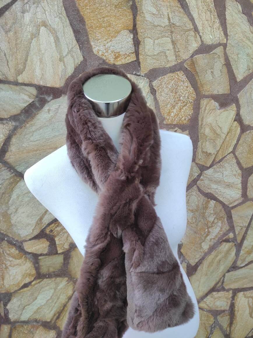 Rex Rabbit Fur Scarf Chocolate Brown - Tatifurs displayed on a mannequin against a stone wall background.