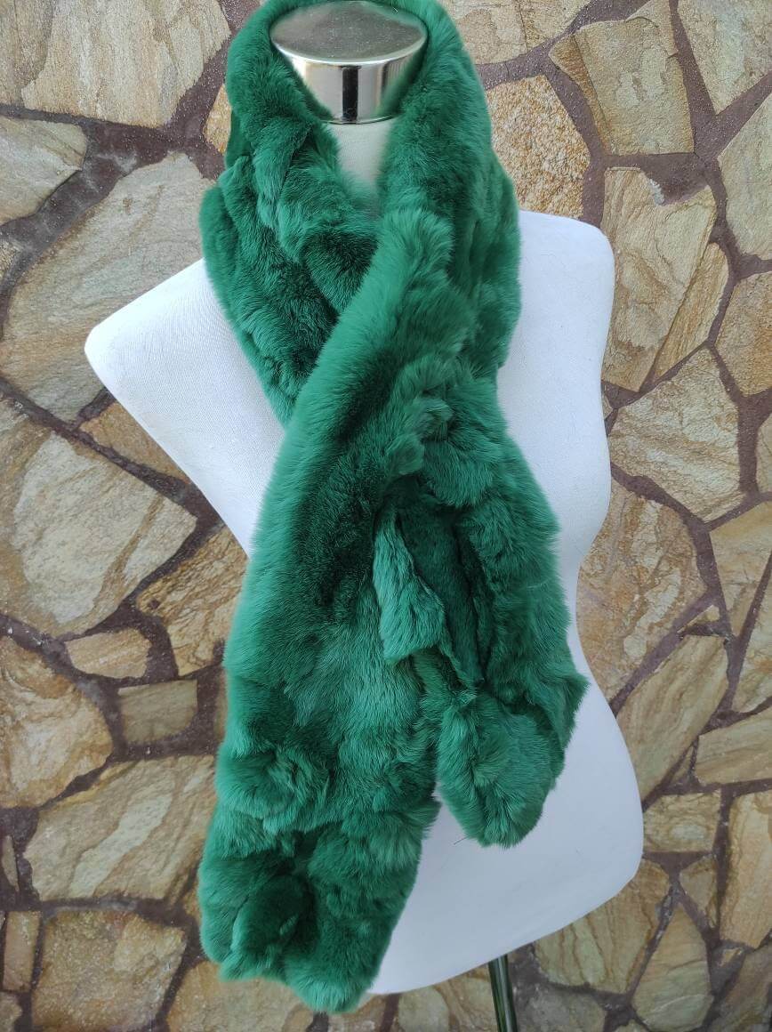 Rex Rabbit Fur Scarf Green - Tatifurs displayed on a mannequin against a stone wall background.